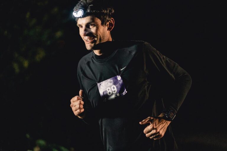 A runner in the dark with a head torch