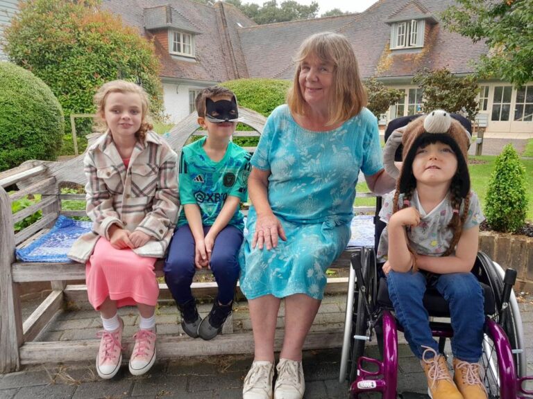 Julia Donaldson and 3 children outside the House