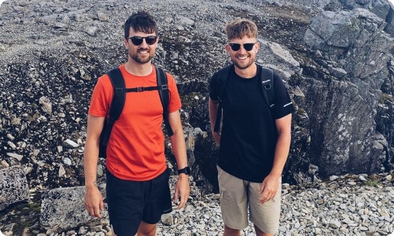 Charlie and Joe Milner-Smith stand in the Peaks on their cycle challenge