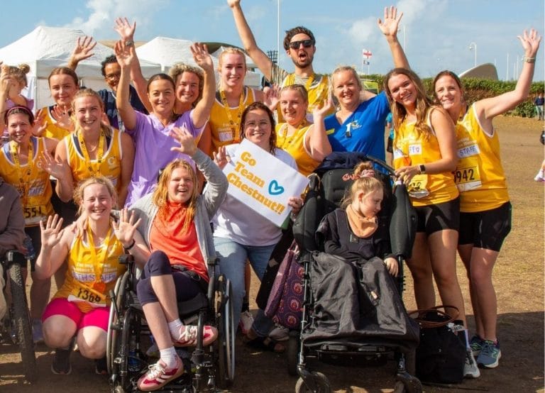 Chestnut Tree House staff team and children in the cheer squad at the Littlehampton 10k