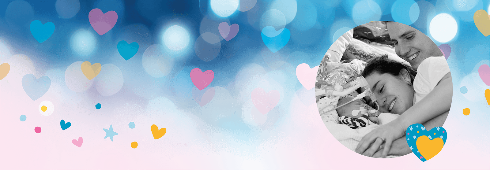 Zoe and Owen lying with baby Loui on a bed. The photo is surrounded by colourful hearts and stars