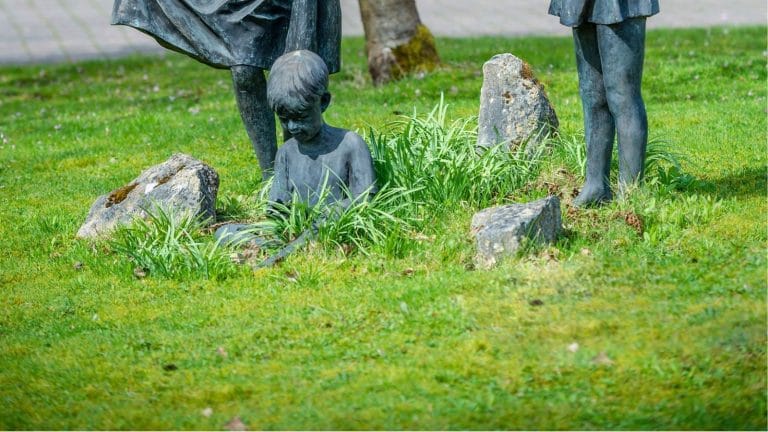 Close up of stolen statue of boy