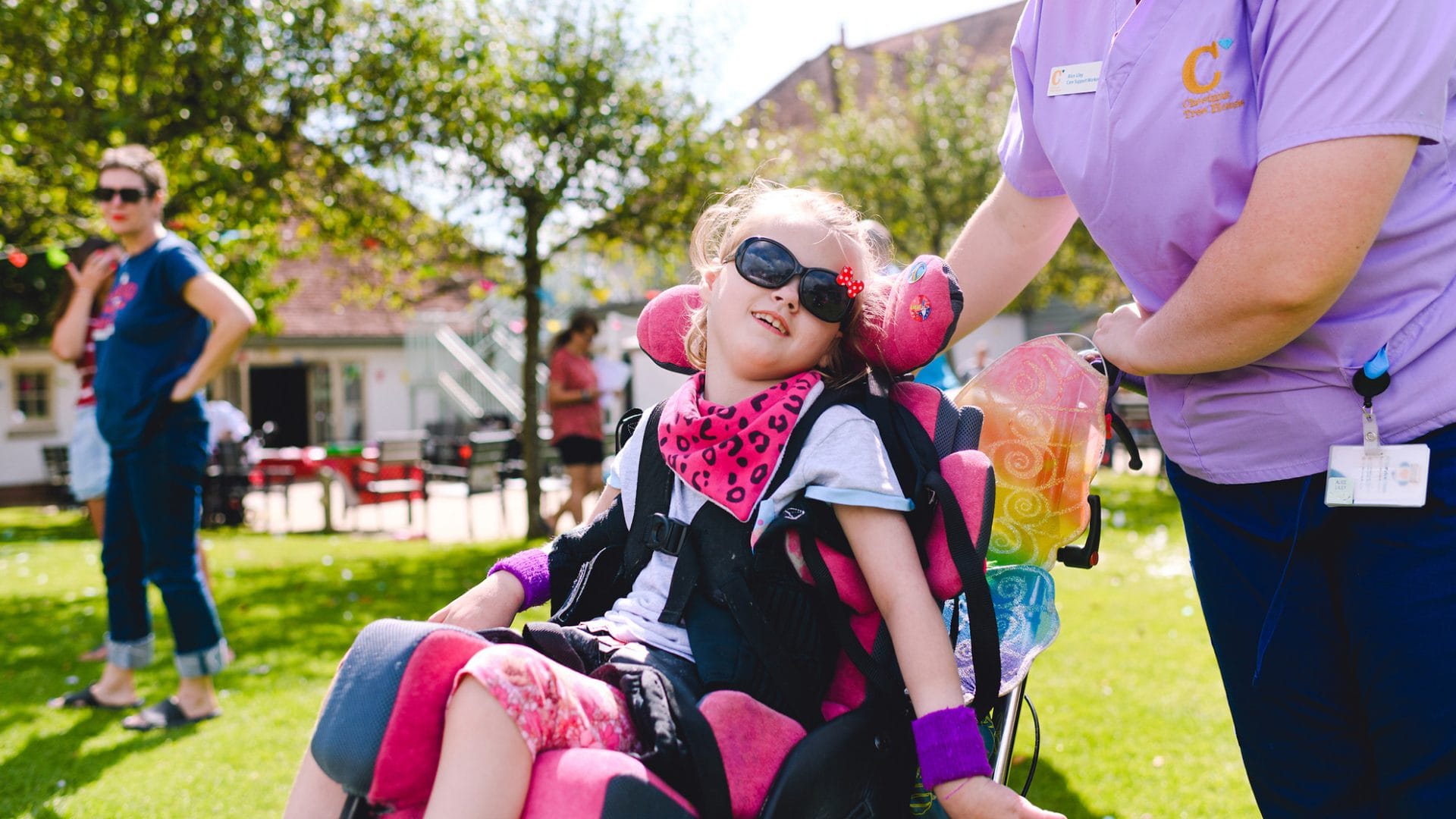 a child in a wheelchair in the chestnut tree house garden