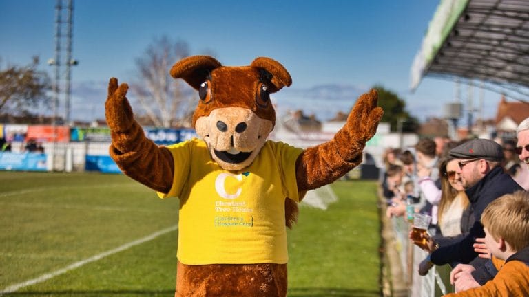sydney squirrel the Chestnut Tree House mascot at a football game