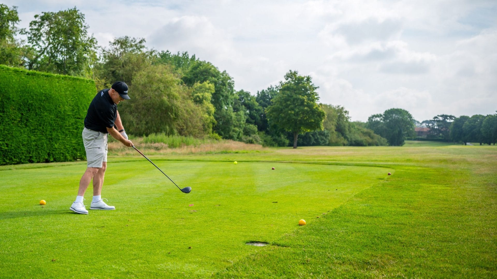 Golfer taking part in a charity golf day at Ham Manor